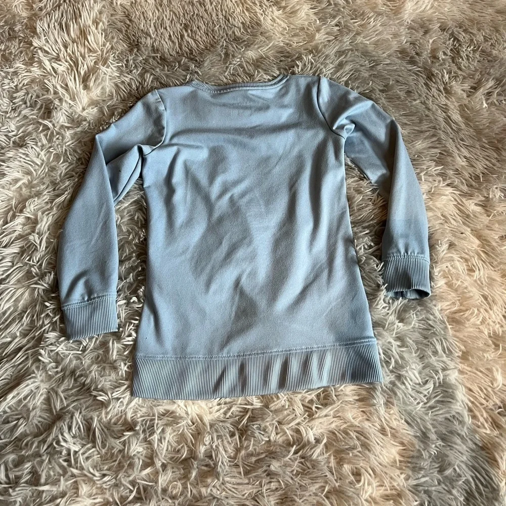 Girls Nike Dri-Fit blue sweatshirt with pink Swoosh